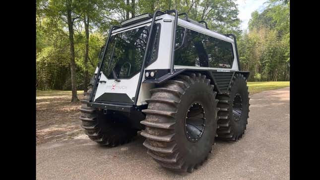 A front 3/4 shot of the Fat Truck parked in a wooded area